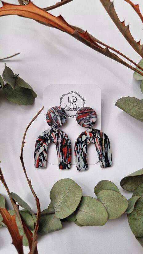 Auskari "Saulriets tumsā"